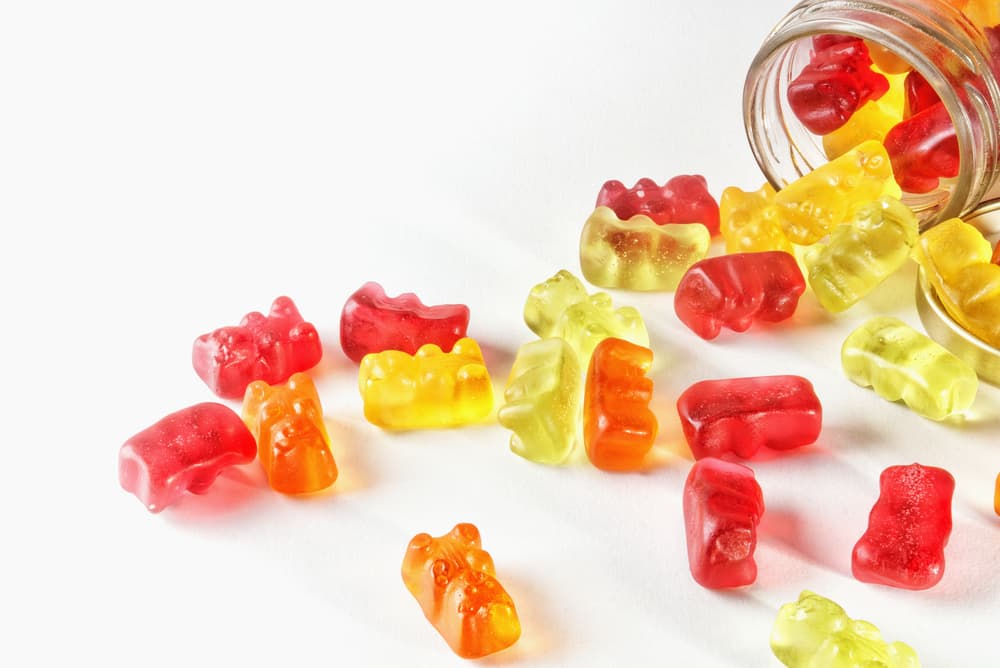 gummies-isolated-background-glass-container